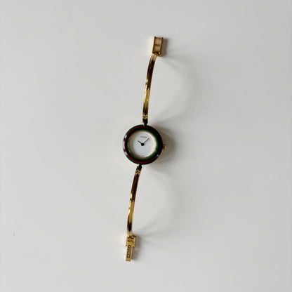 Gucci 1990s Interchangeable Bezel Gold Plated Bangle Watch with 12 bezels, case