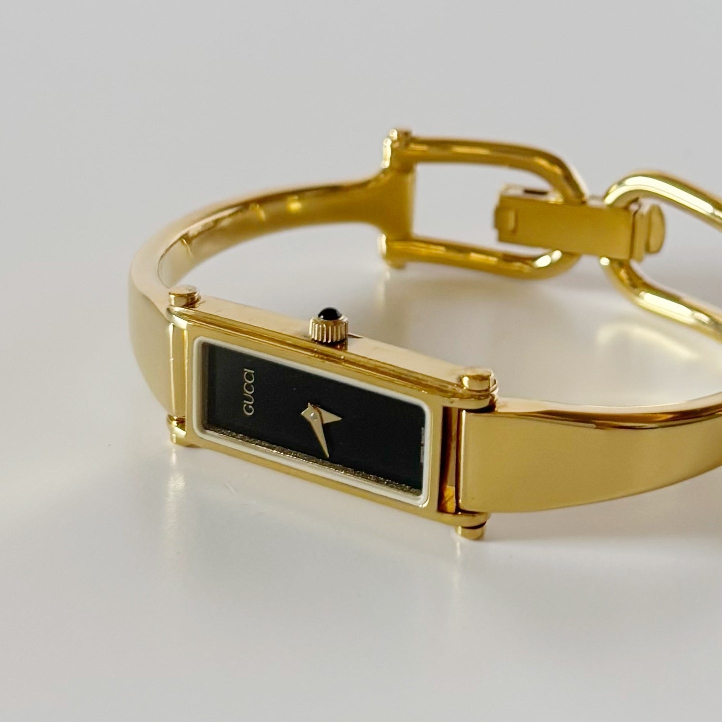 Gucci 1990s Black Rectangular Dial Gold Plated Bangle Watch