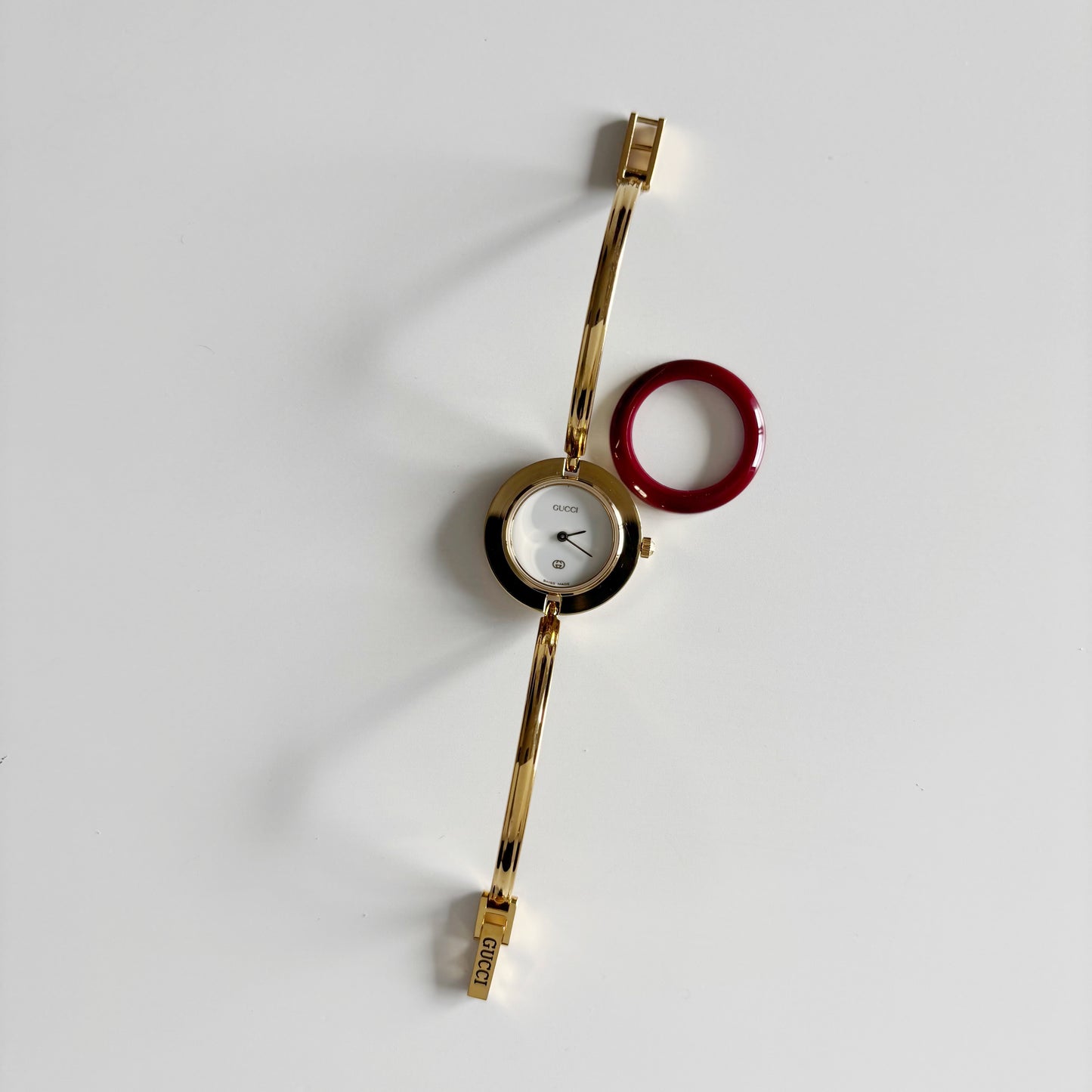 Gucci 1990s Interchangeable Bezel Gold Plated Bangle Watch with 12 bezels, case