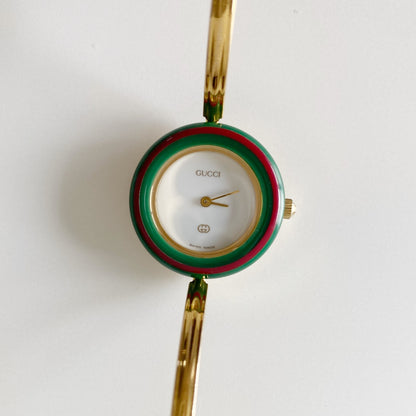 Gucci 1990s Interchangeable Bezel Gold Plated Bangle Watch with 12 bezels, case