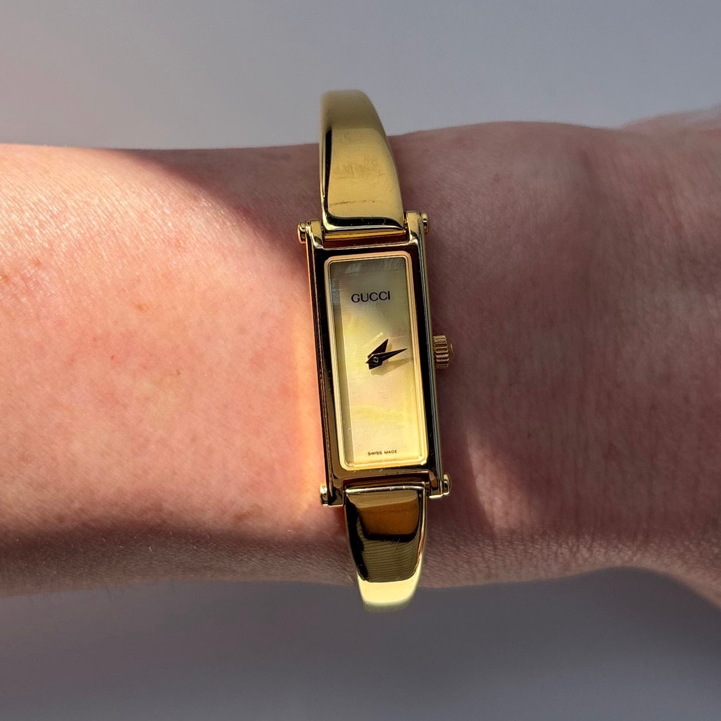 Gucci 1990s Rectangular Seashell Dial Gold Plated Bangle Watch