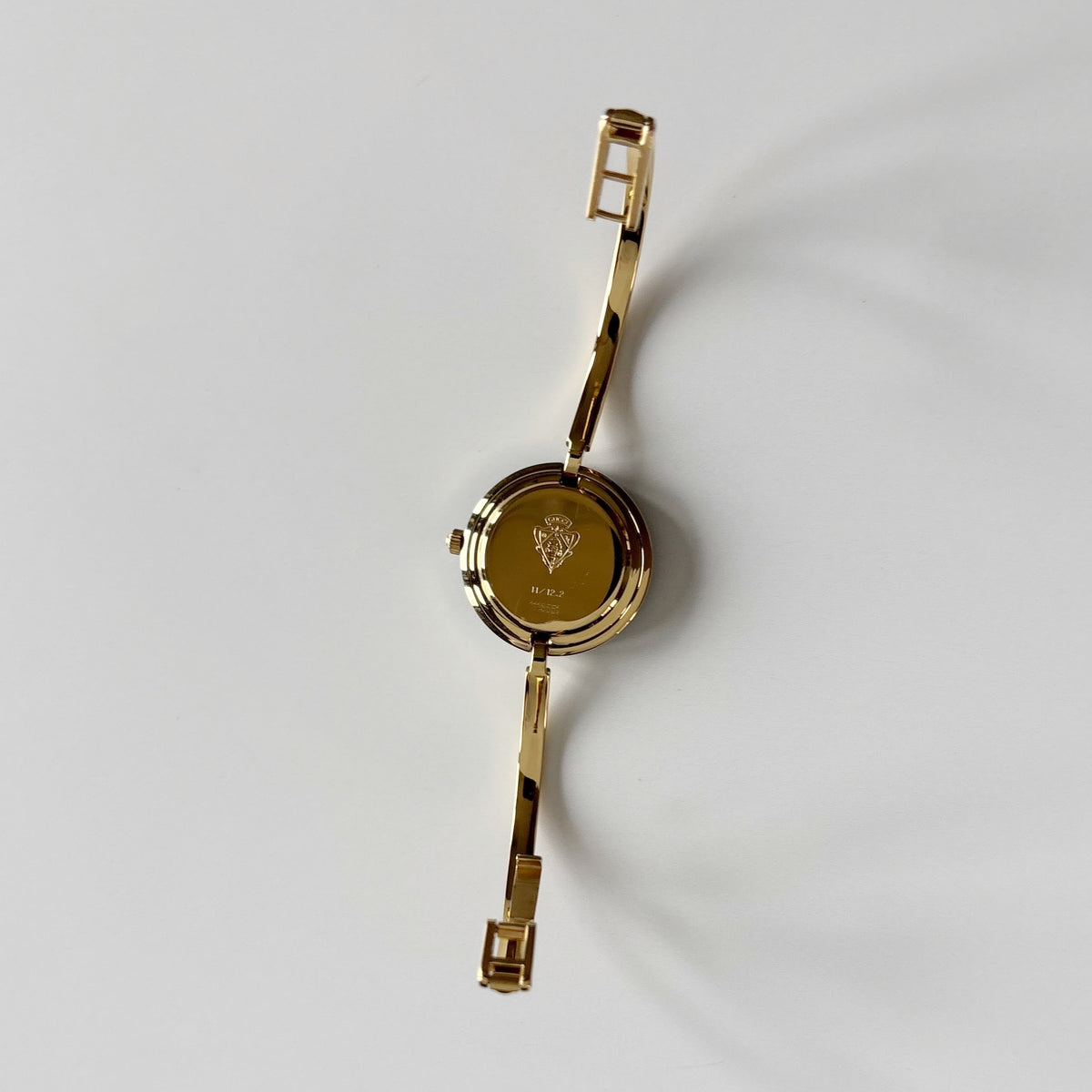 Gucci 1990s Interchangeable Bezel Gold Plated Bangle Watch with 12 bezels, case
