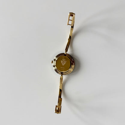 Gucci 1990s Interchangeable Bezel Gold Plated Bangle Watch with 12 bezels, case