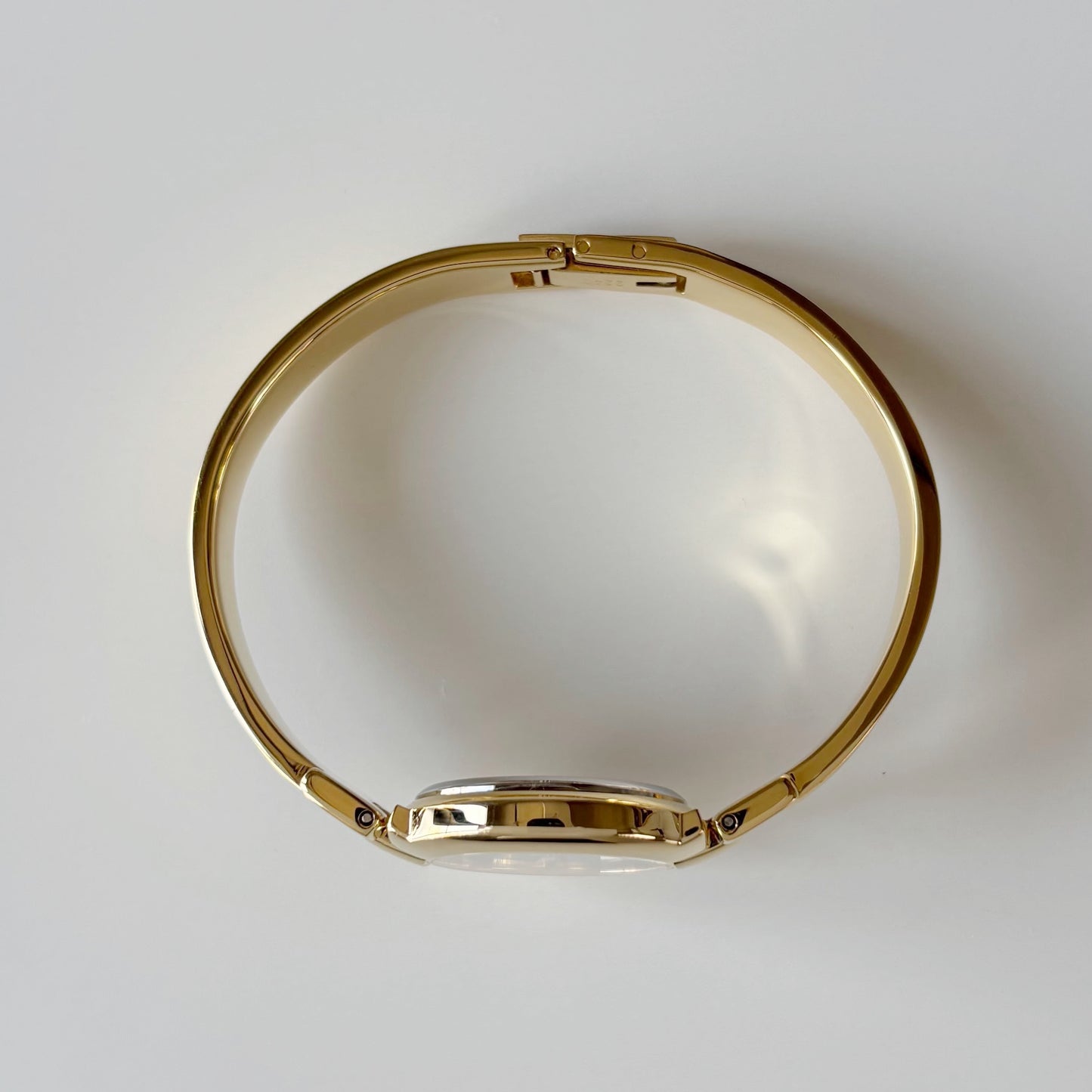 Givenchy 1990s Black Round Dial Gold Plated Bangle Watch