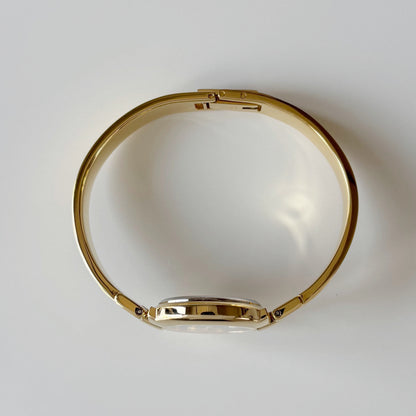 Givenchy 1990s Black Round Dial Gold Plated Bangle Watch
