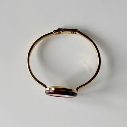 Gucci 1990s Interchangeable Bezel Gold Plated Bangle Watch with 12 bezels, case