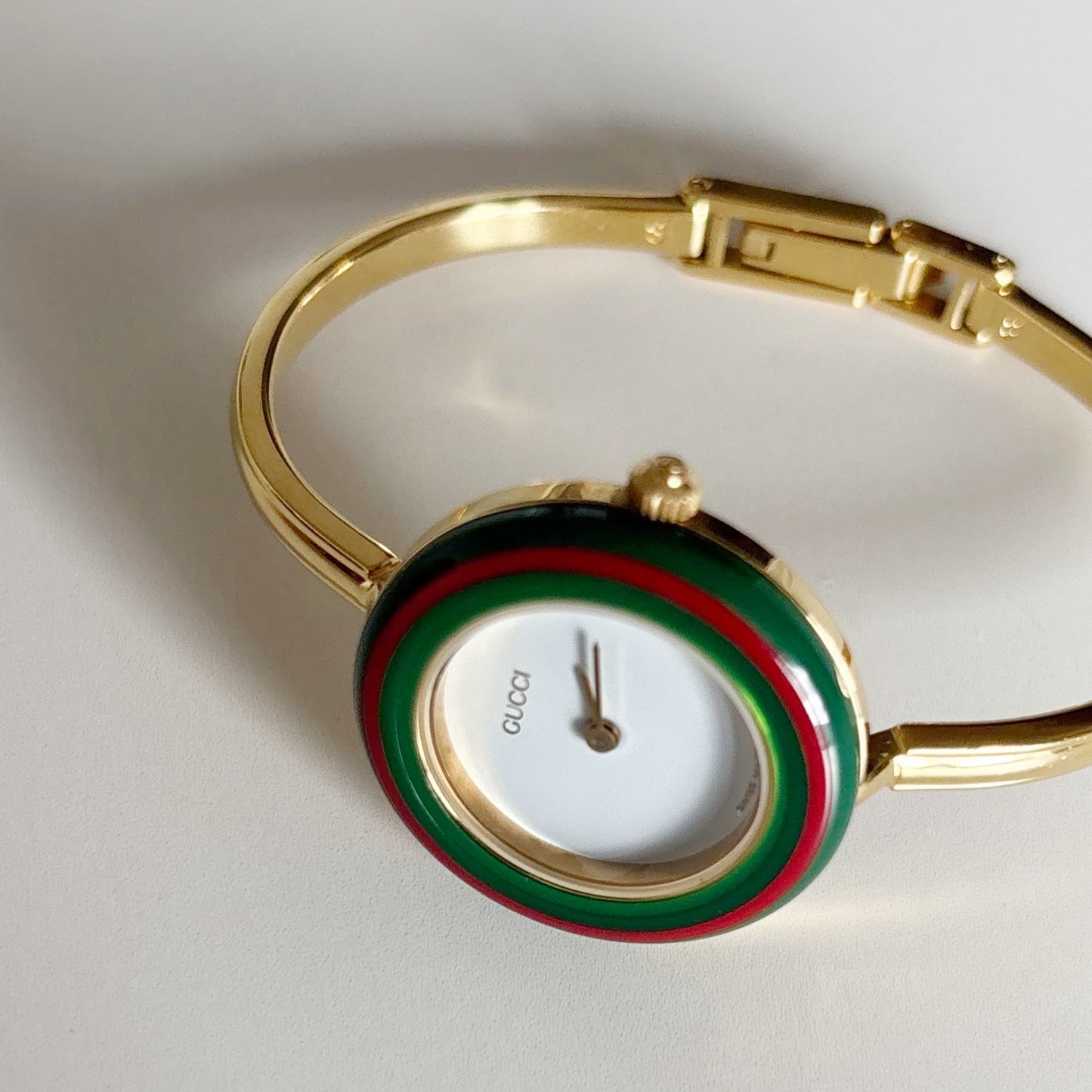 Gucci 1990s Interchangeable Bezel Gold Plated Bangle Watch with 12 bezels, case (Small)