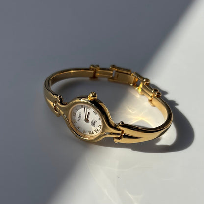 Burberry 1990s Round Dial Gold Plated Bangle Watch