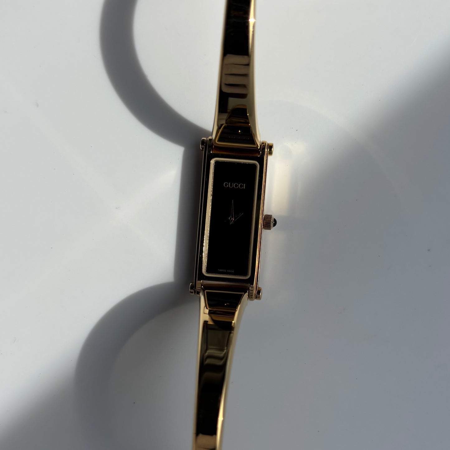 Gucci 1990s Rectangular Black Dial Gold Plated Bangle Watch