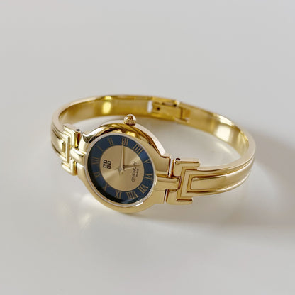 Givenchy 1990s Round Dial Gold Plated Bangle Watch