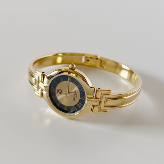 Givenchy 1990s Round Dial Gold Plated Bangle Watch