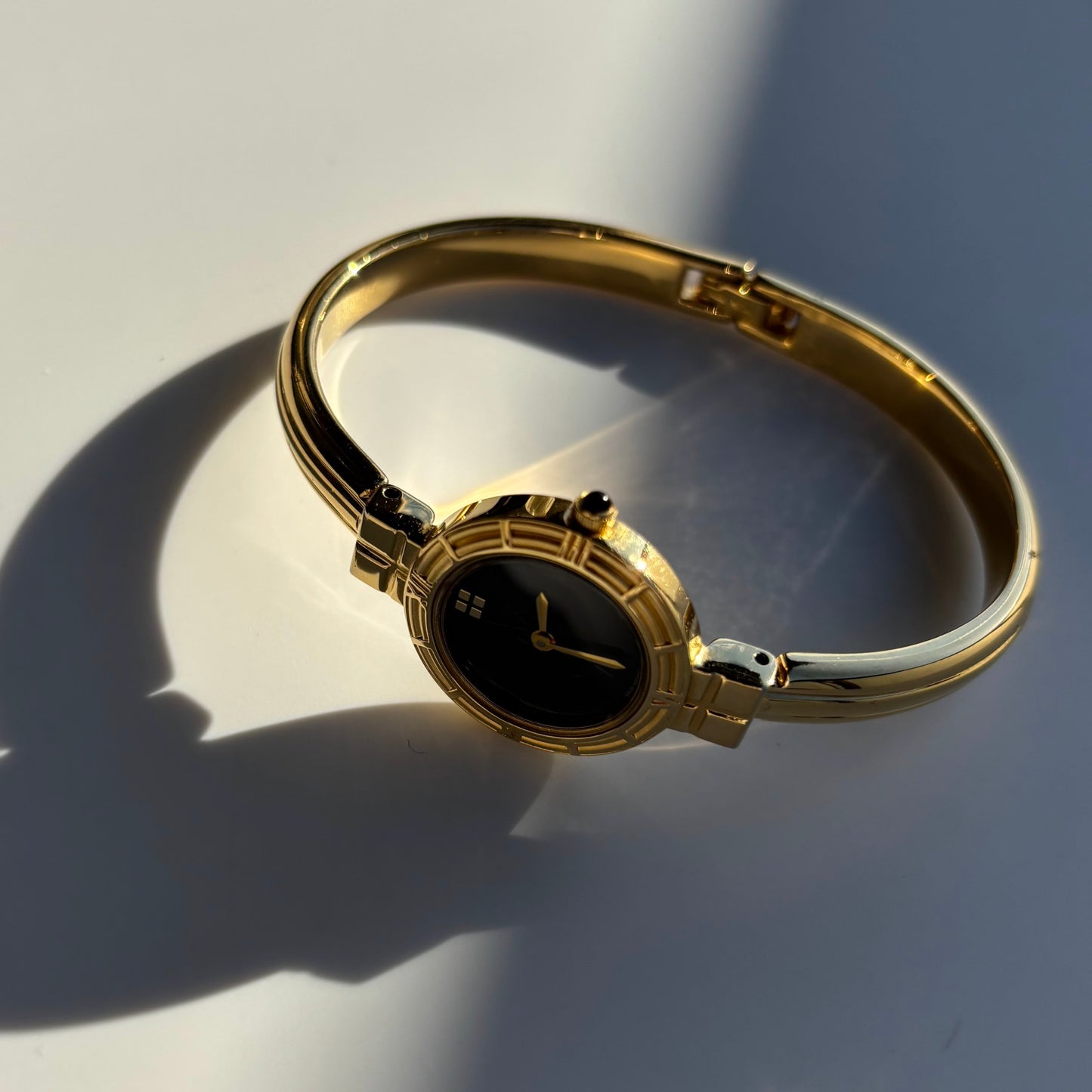 Yves Saint Laurent 1990s Black Round Dial Gold Plated Bangle Watch