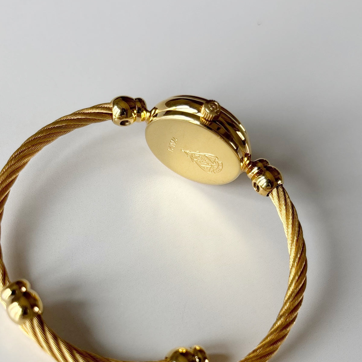 Gucci 1990s Black Round Dial Cable Gold Plated Bangle Watch