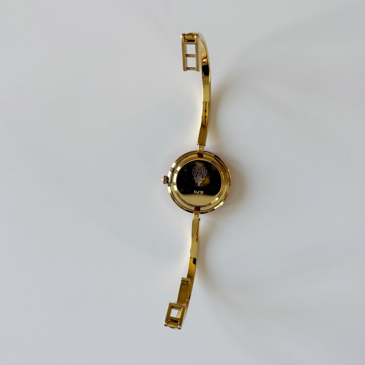 Gucci 1990s Interchangeable Bezel Gold Plated Bangle Watch with 12 bezels, case