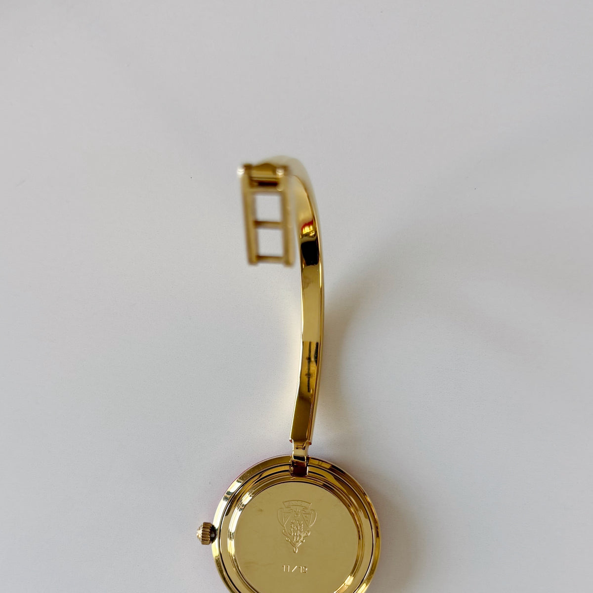 Gucci 1990s Interchangeable Bezel Gold Plated Bangle Watch with 12 bezels, case