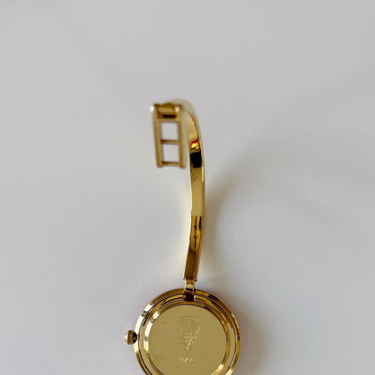Gucci 1990s Interchangeable Bezel Gold Plated Bangle Watch with 12 bezels, case
