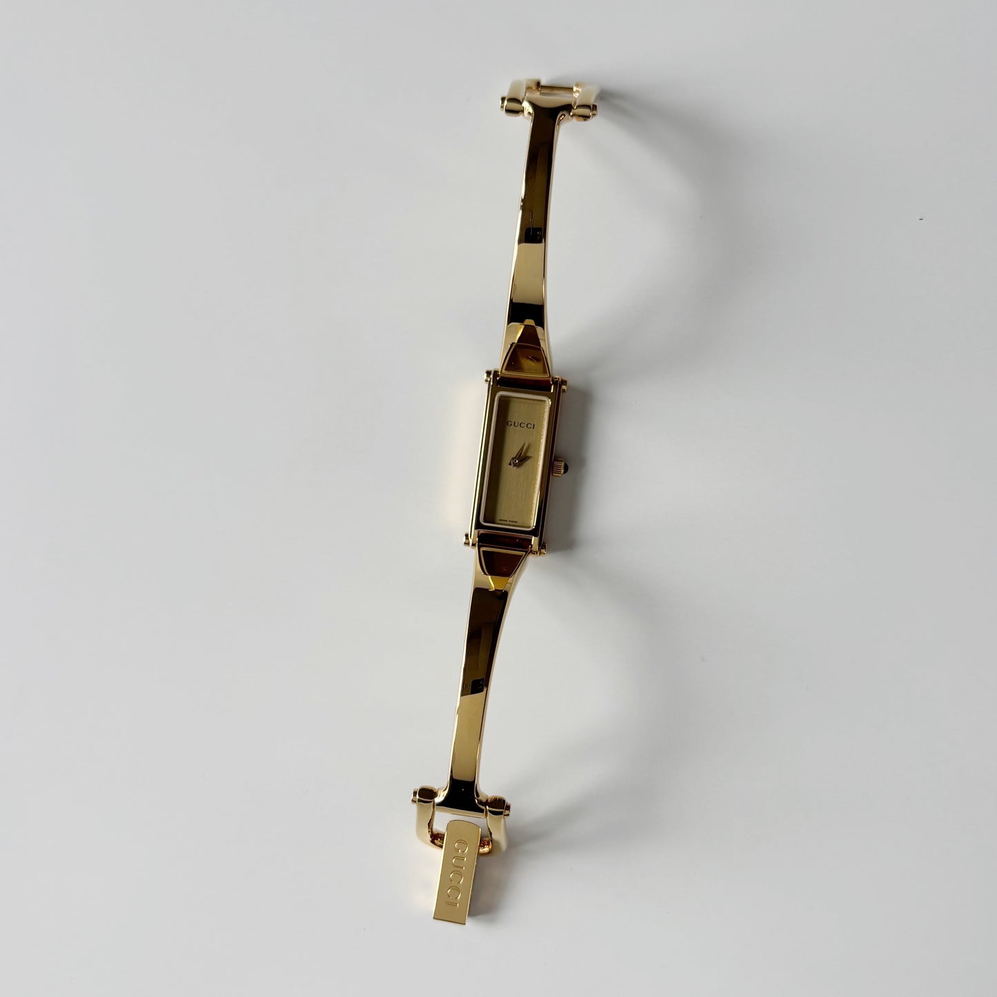 Gucci 1990s Gold Rectangular Dial Gold Plated Bangle Watch