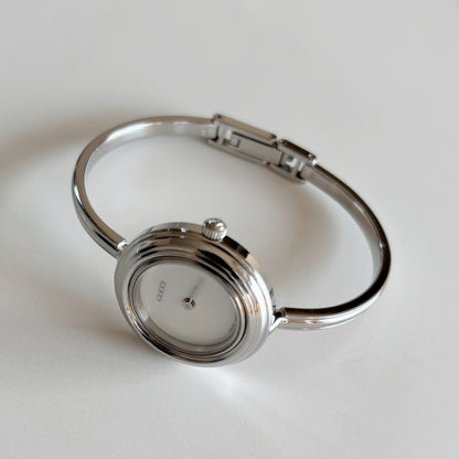 Gucci 1990s Interchangeable Bezel Stainless steel Bangle Watch with 12 bezels, case (Small)