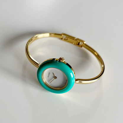 Gucci 1990s Interchangeable Bezel Gold Plated Bangle Watch with 12 bezels, case