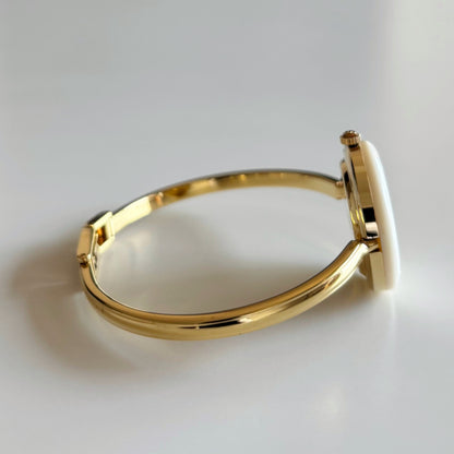 Gucci 1990s Interchangeable Bezel Gold Plated Bangle Watch with 12 bezels, case
