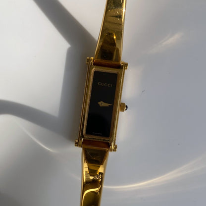 Gucci 1990s Black Dial Gold Plated Rectangular Bangle Watch