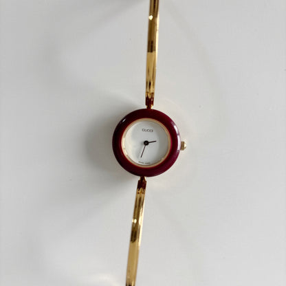 Gucci 1990s Interchangeable Bezel Gold Plated Bangle Watch with 12 bezels, case