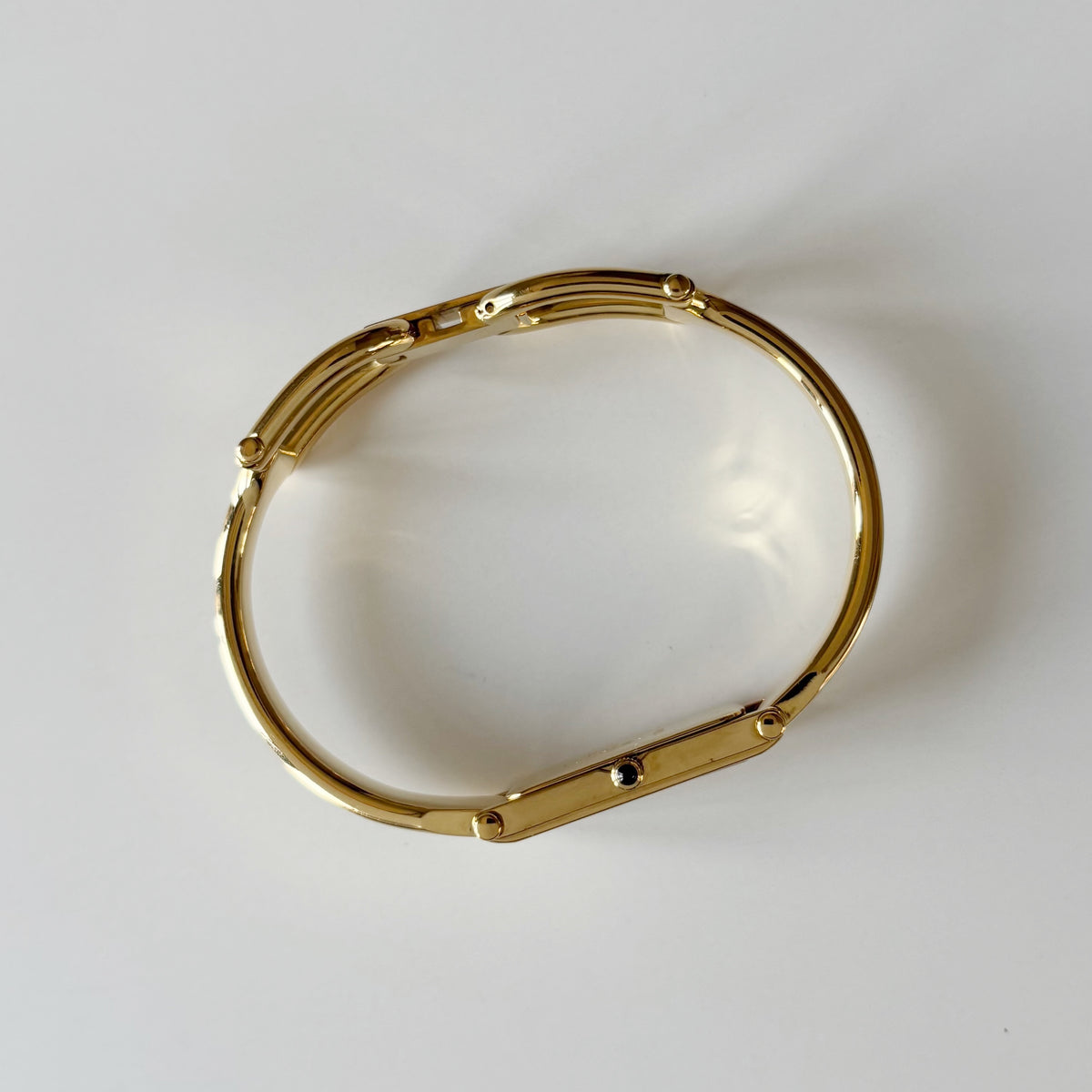 Gucci 1990s Rectangular Gold Dial Gold Plated Bangle Watch