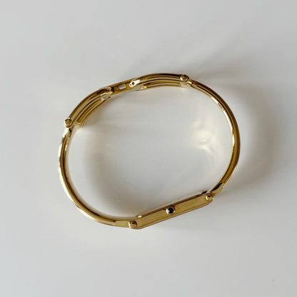 Gucci 1990s Rectangular Gold Dial Gold Plated Bangle Watch