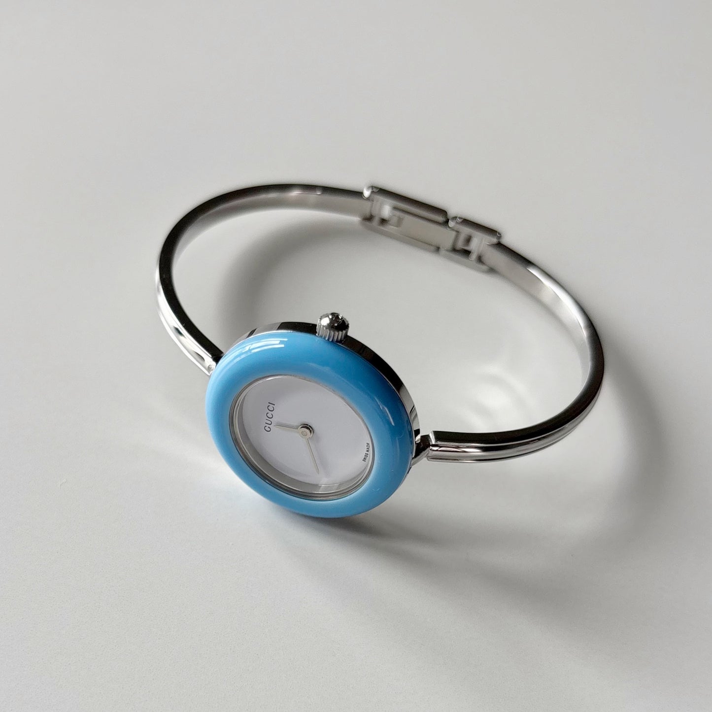 Gucci 1990s Interchangeable Bezel Silver Stainless steel Bangle Watch with 12 bezels, case