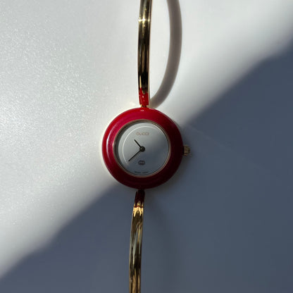 Gucci 1990s Interchangeable Bezel Gold Plated Bangle Watch with 12 bezels, case