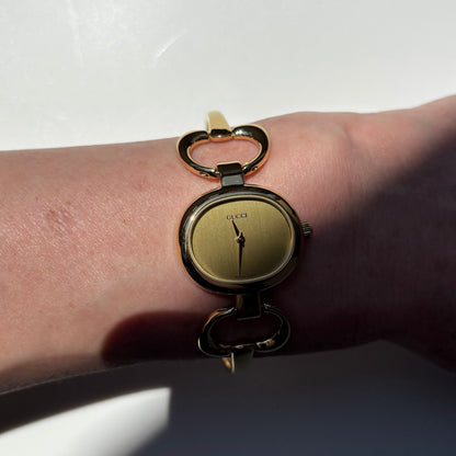Gucci 1990s Oval Dial Gold Plated Bangle Watch