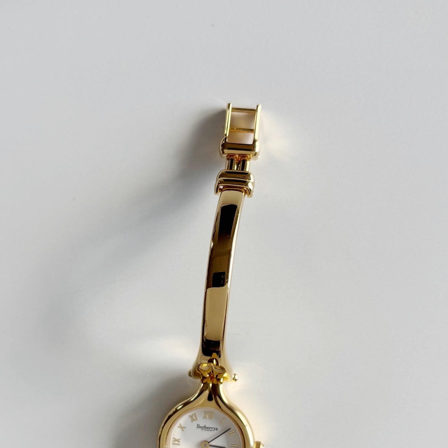 Burberry 1990s Round Dial Gold Plated Bangle Watch