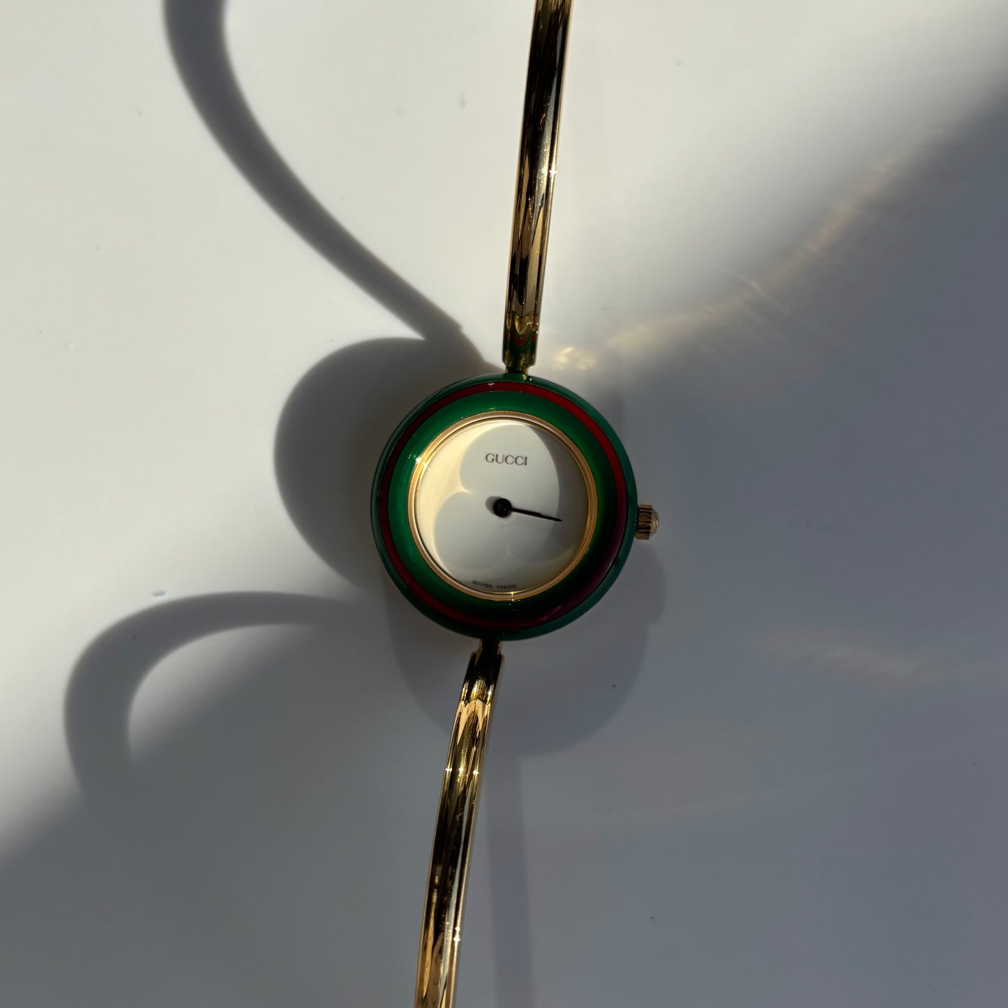 Gucci 1990s Interchangeable Bezel Gold Plated Bangle Watch with 12 bezels, case