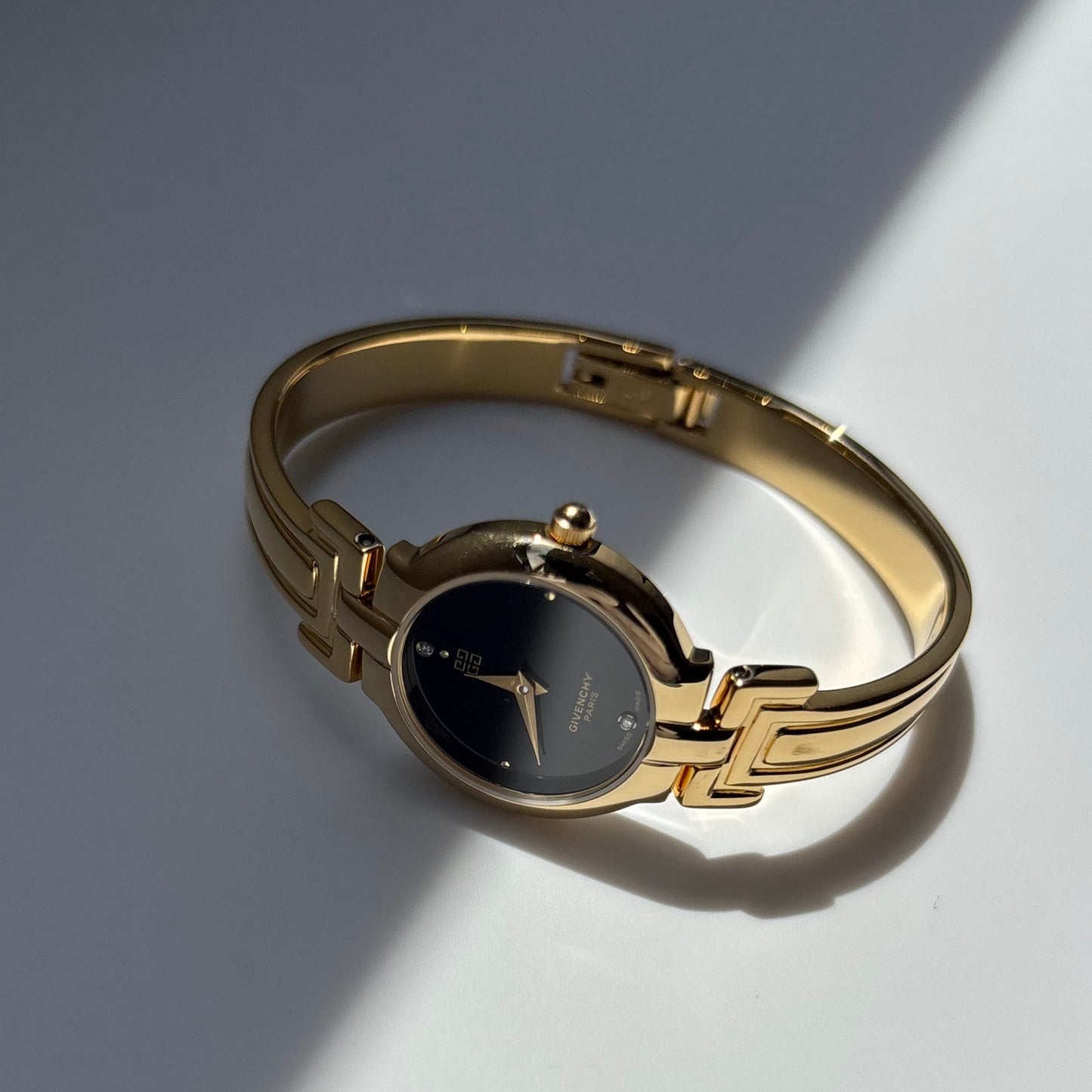 Givenchy 1990s Black Round Dial Gold Plated Bangle Watch