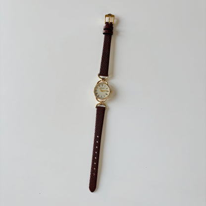 Gucci 1990s Round Cream Dial Horsebit Gold Plated Watch