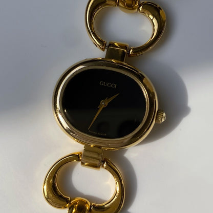 Gucci 1990s Black Dial Gold Plated Bangle Watch