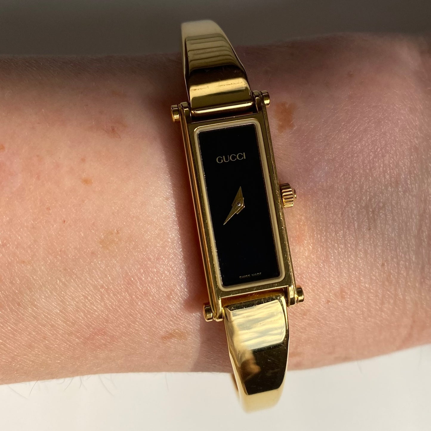 Gucci 1990s Black Dial Gold Plated Bangle Watch