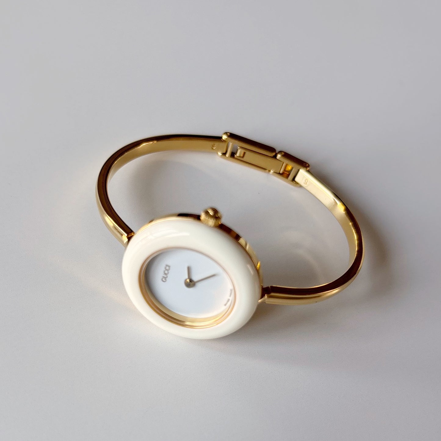 Gucci 1990s Interchangeable Bezel Gold Plated Bangle Watch with case, 12 bezels (Small)