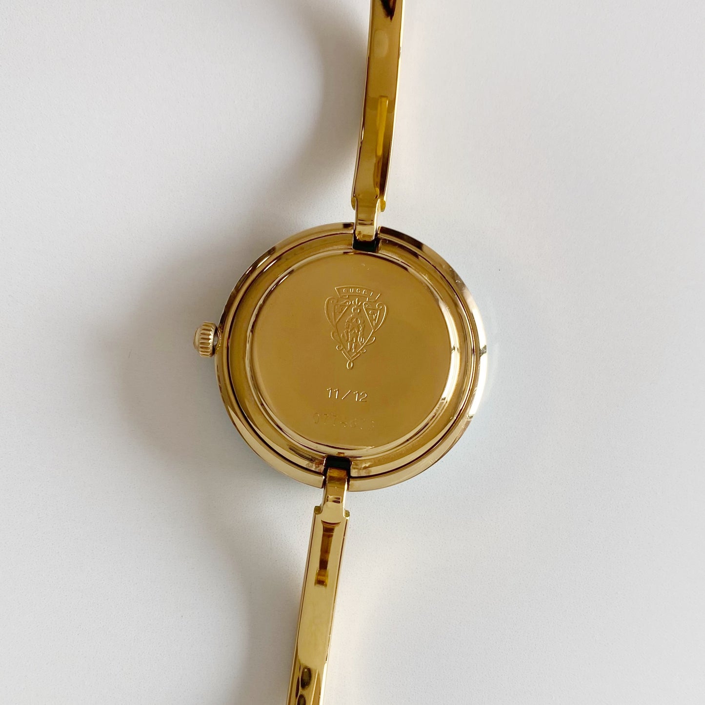Gucci 1990s Interchangeable Bezel Gold Plated Bangle Watch with 12 bezels, case