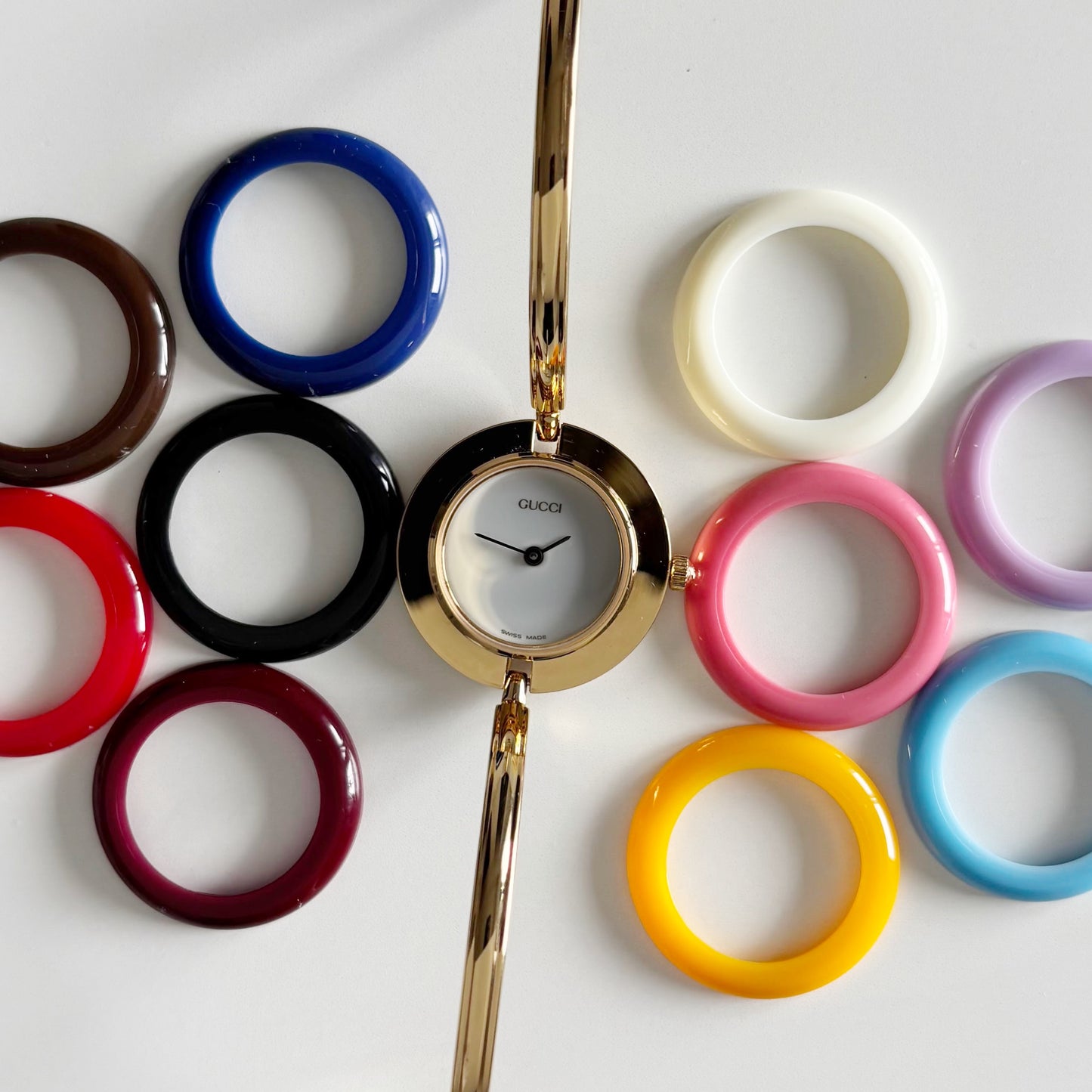 Gucci 1990s Interchangeable Bezel Gold Plated Bangle Watch with 12 bezels, case