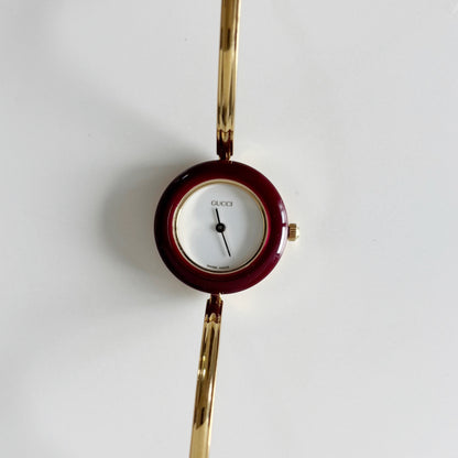 Gucci 1990s Interchangeable Bezel Gold Plated Bangle Watch with 12 bezels, case