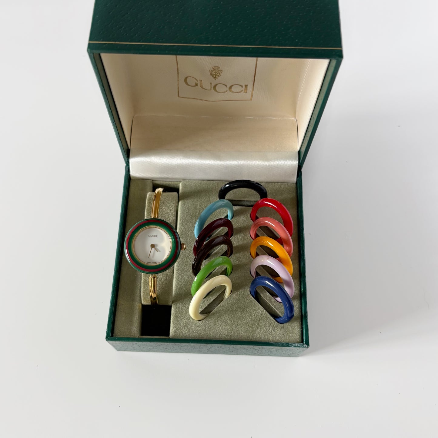 Gucci 1990s Interchangeable Bezel Gold Plated Bangle Watch with 12 bezels, case