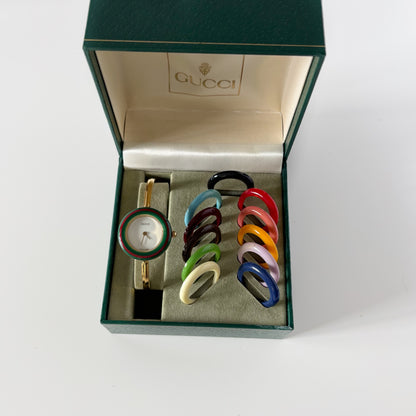Gucci 1990s Interchangeable Bezel Gold Plated Bangle Watch with 12 bezels, case