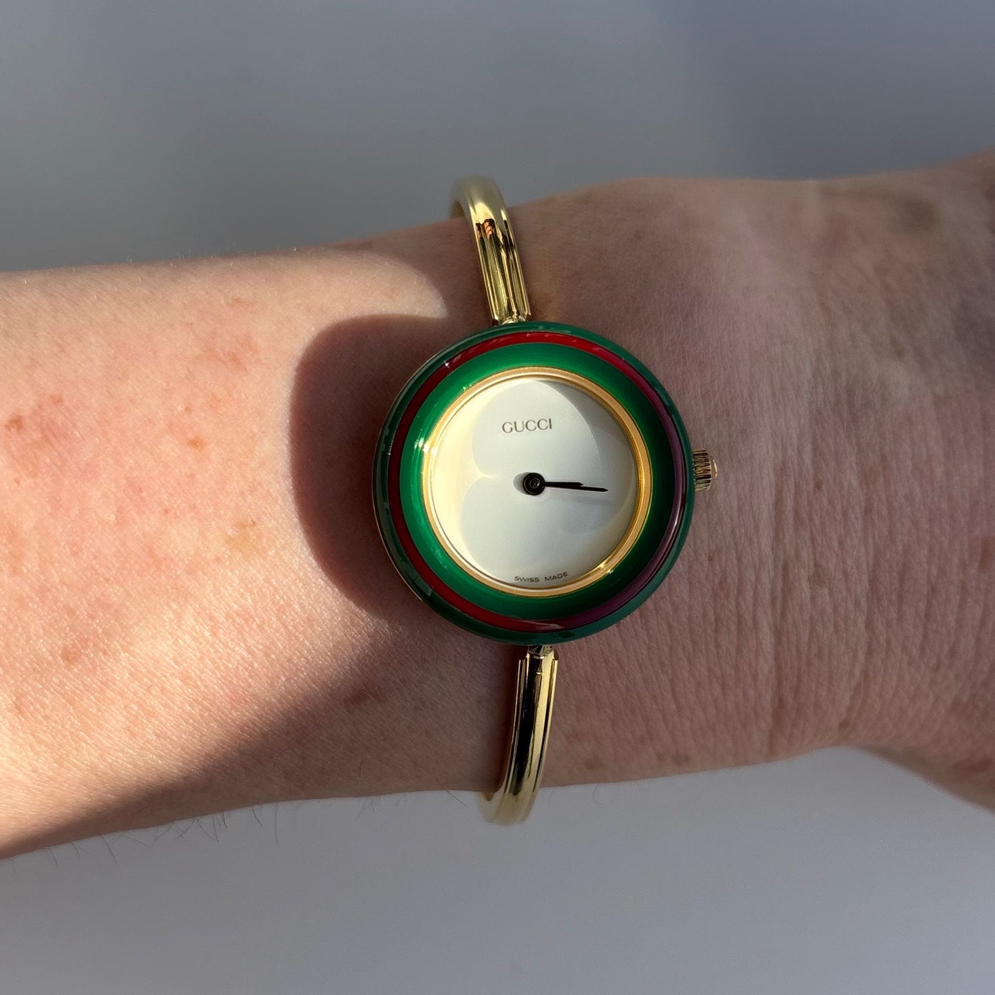 Gucci 1990s Interchangeable Bezel Gold Plated Bangle Watch with 12 bezels, case