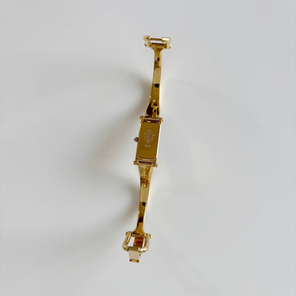 Gucci 1990s Black Dial Rectangular Gold Plated Bangle Watch