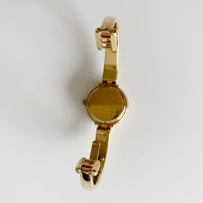 Gucci 1990s Round Dial Gold Plated Bangle Watch