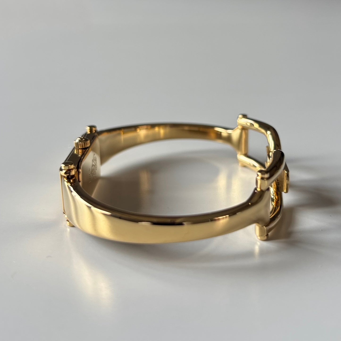 Gucci 1990s Gold Rectangular Dial Gold Plated Bangle Watch