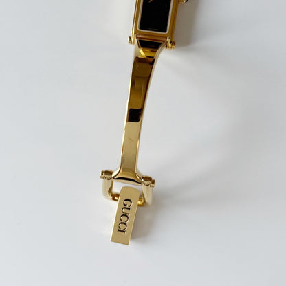 Gucci 1990s Black Dial Gold Plated Bangle Watch
