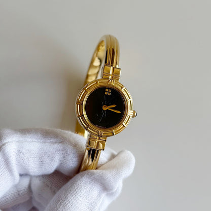 Yves Saint Laurent 1990s Black Round Dial Gold Plated Bangle Watch