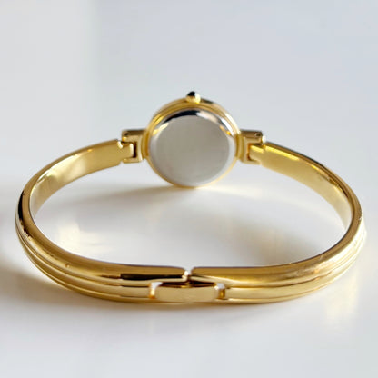 Yves Saint Laurent 1990s Black Round Dial Gold Plated Bangle Watch